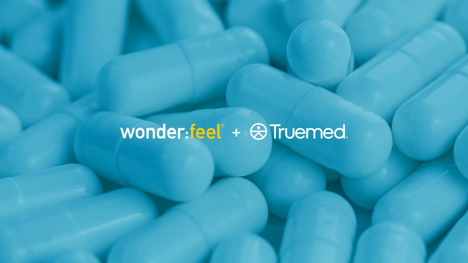 The image shows blue capsules with the "Wonderfeel" and "Truemed" logos in the center, suggesting a partnership between the two brands.