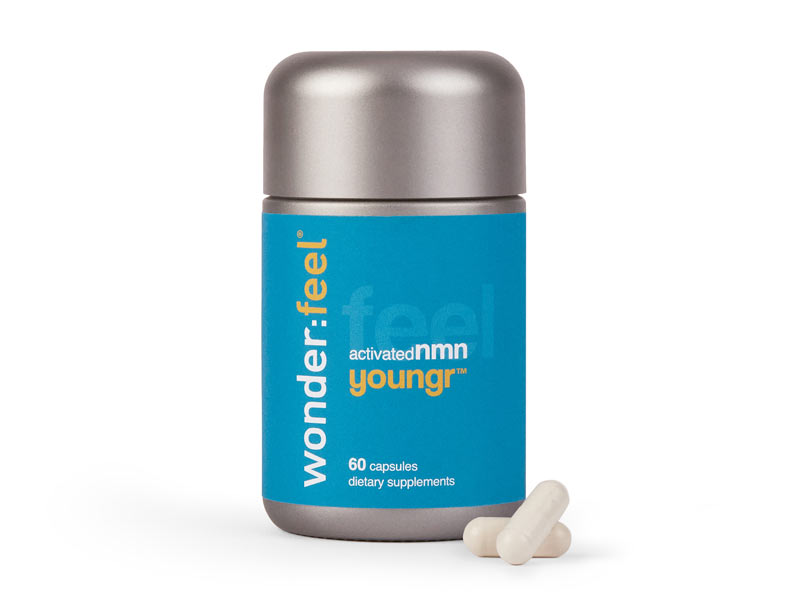 Elegant silver, peacock blue, and yellow Wonderfeel Youngr NMN Bottle with two daily capsules shown in foreground