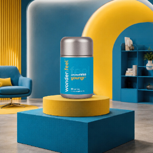 Wonderfeel Youngr™ NMN supplement bottle displayed on a yellow and teal pedestal in a stylish blue and yellow room with an armchair and bookshelf in the background.